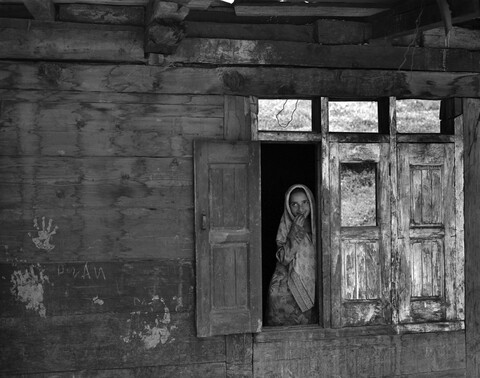 Kashira Bala girl in window Lolab Valley, Kashmir. May 2016