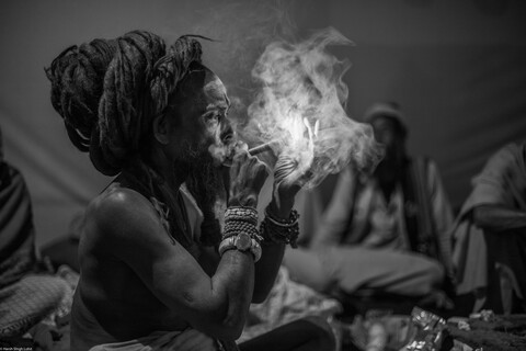 Kumbh Sadhu Lighting Up Sangam, Uttar Pradesh. February 2019