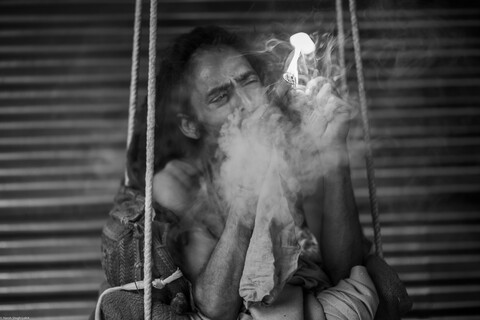 Kumbh Sadhu Lighting Up 3 Sangam, Uttar Pradesh. February 2019